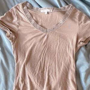 Cute lace beige top thin material but feels nice